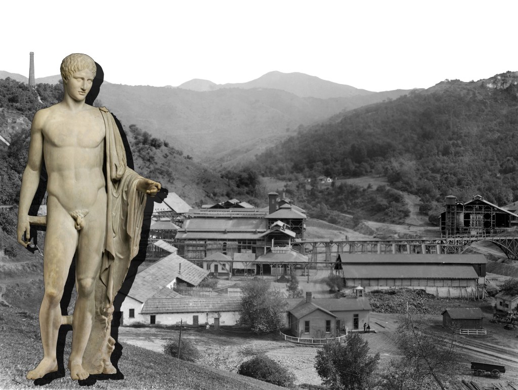 Another half archival half non-archival image.  On the left side of the foreground is an off-white image of Mercurius, or Mercury, a major god in Roman mythology. He has a cloth draped over his left shoulder and left arm, which he almost seems to be using to point to something.  He has a lefthand dropshadow.  In the background is a black and white image of the New Almaden Mine.  The image shows just the buildings, and a bridge, there are no people. Behind the buildings are tree covered hills, which become lighter gray as they get further away. 