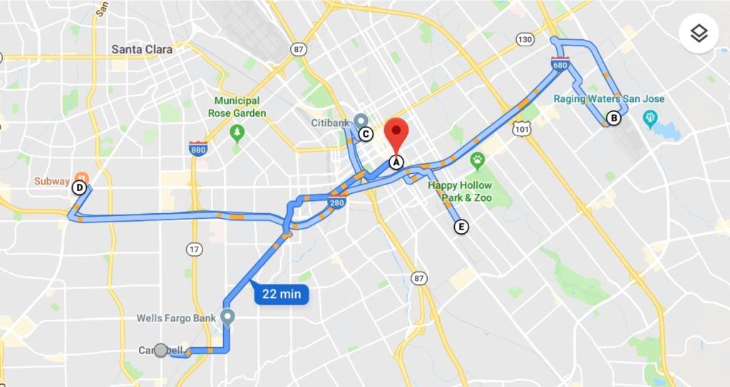 A grey screen shot of google maps shows the travel route that Gaby went on with her family to get to El Chapparral. Their route is depicted in blue with little yellow streaks to denote slowdowns in traffic. A large, red upside down tear drop shows the location of El Chapparral on the map. A small blue box reads "22 minutes".